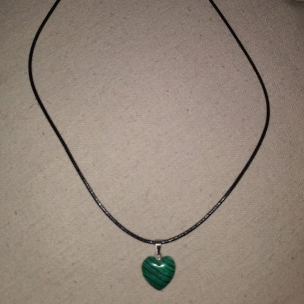 Black and green striped heart shaped stone pendant necklace.